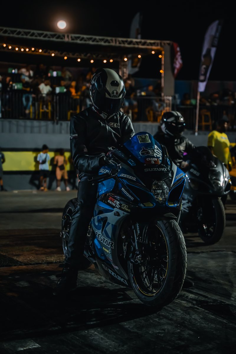 Motorcycle rider at a night racing event