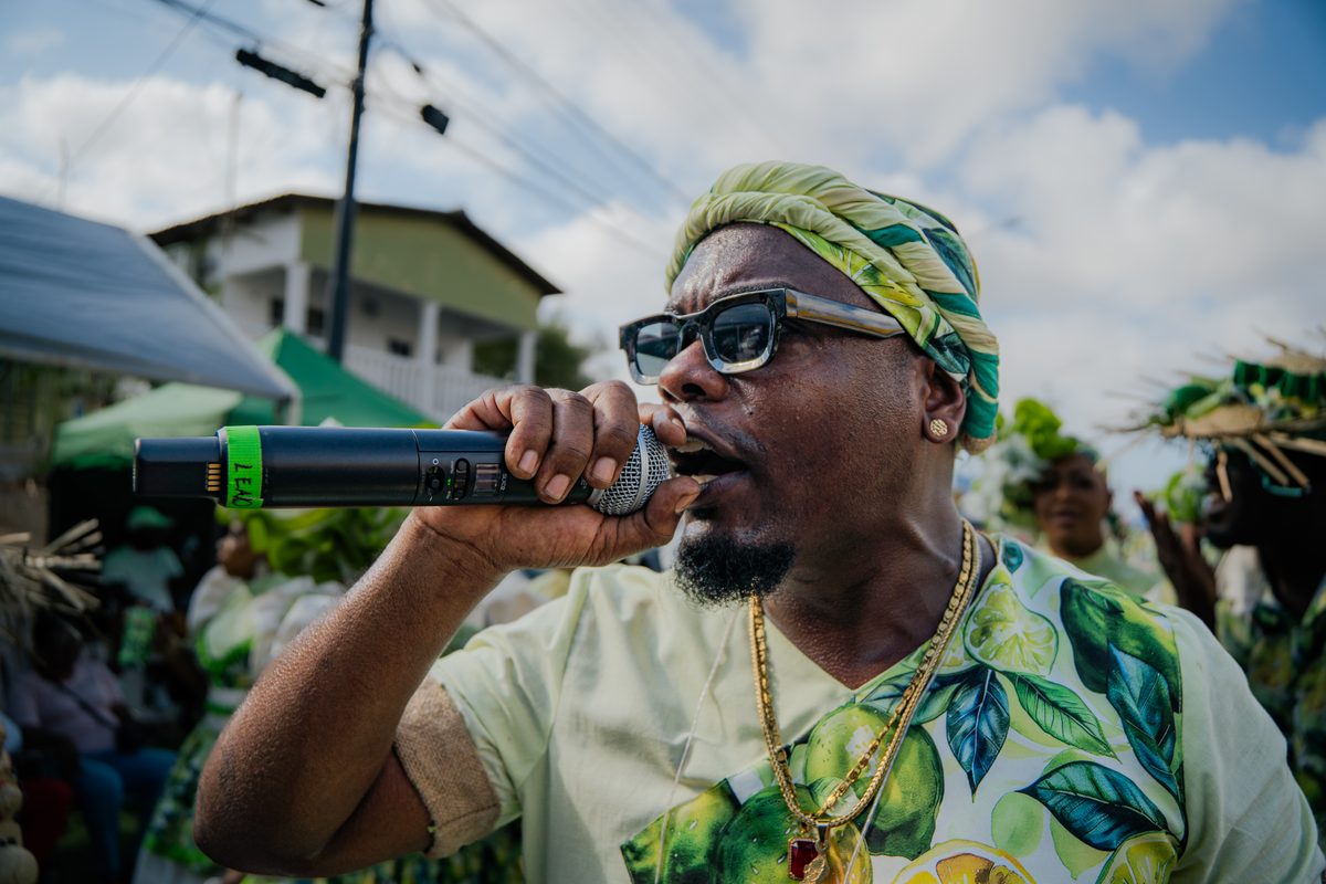 Carnival performer singing into a microphone